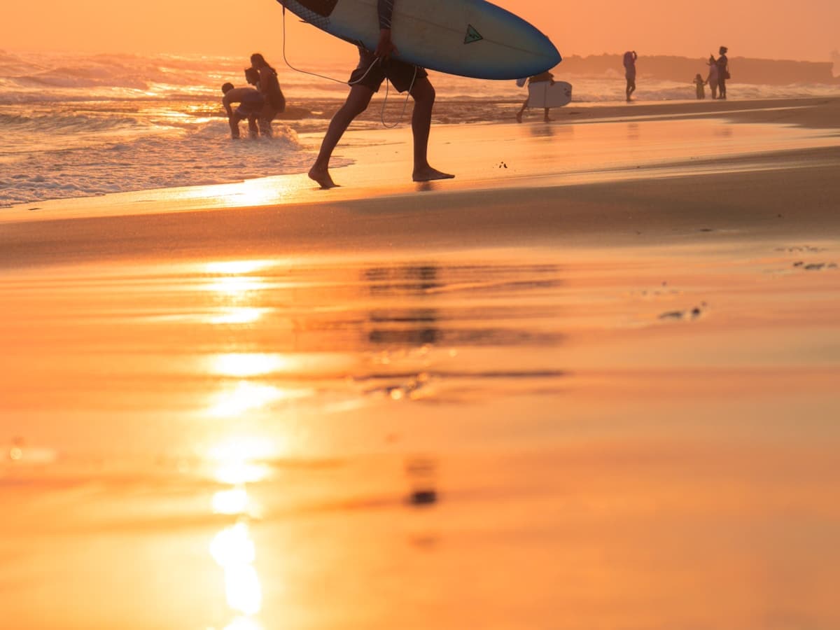 Bali Canggu — surfer paddling out at Echo Beach in the morning