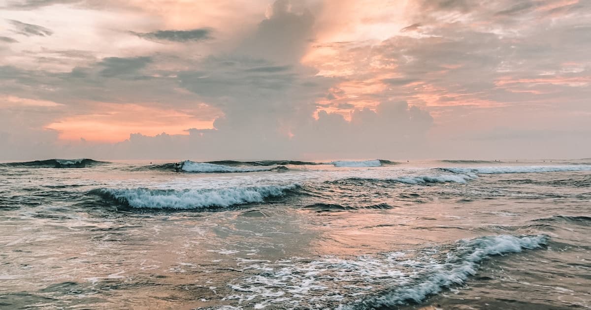 Bali — surfers and black sand beach at Canggu