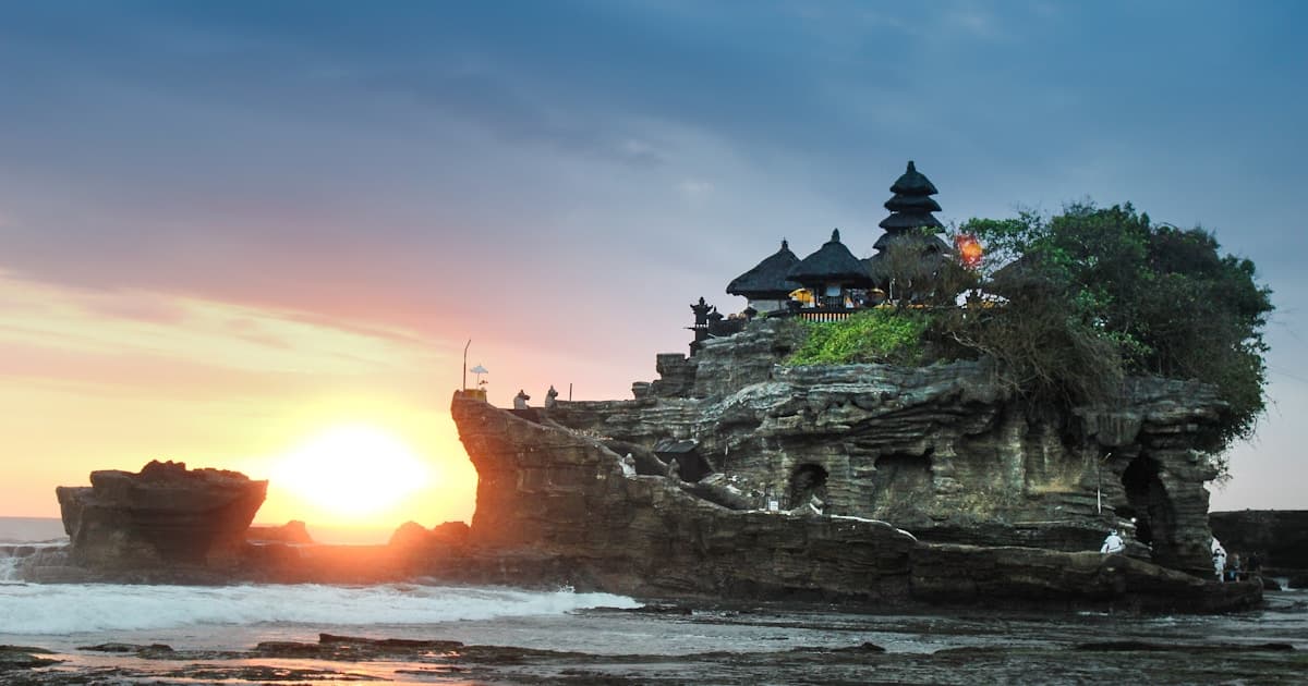 Bali — Uluwatu Temple perched on sea cliffs at sunset